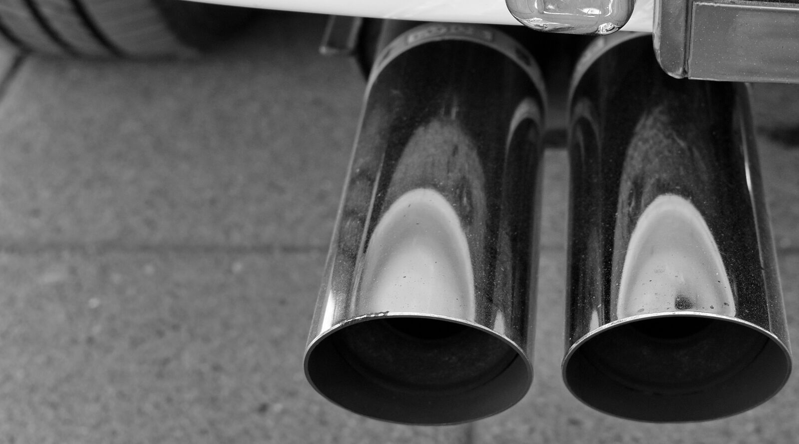 Nikon D5500 sample photo. Metallic, tire, monochrome, street photography