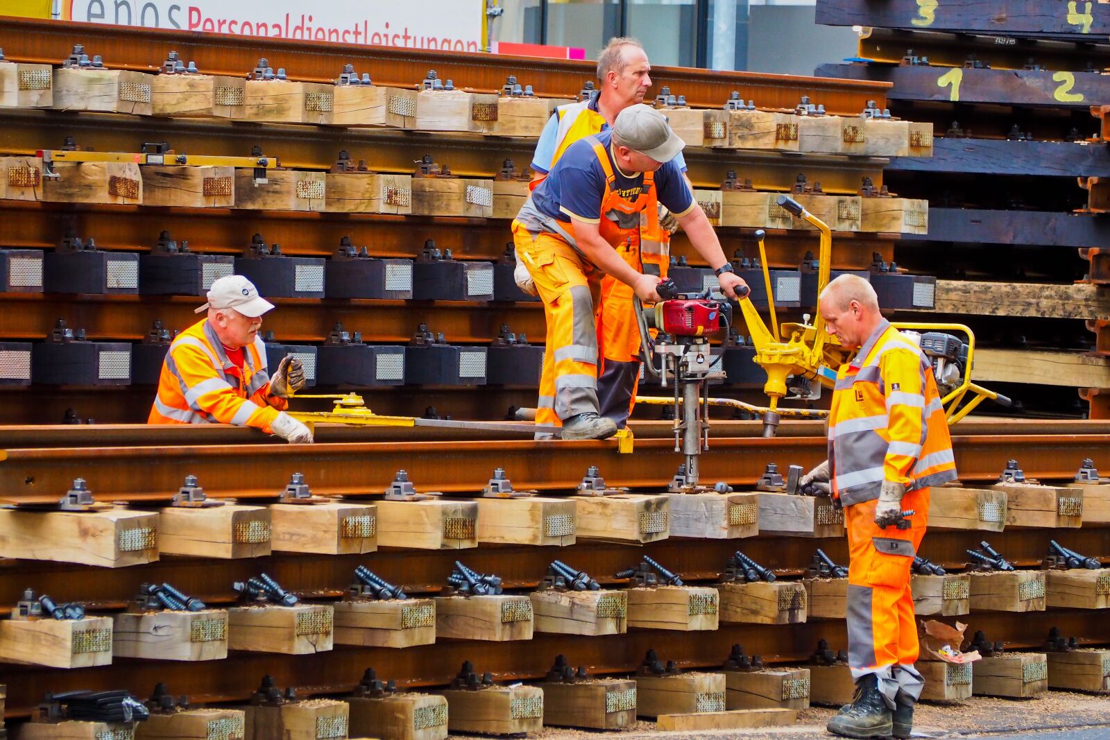 Olympus OM-D E-M10 sample photo. Workers, track construction, construction photography