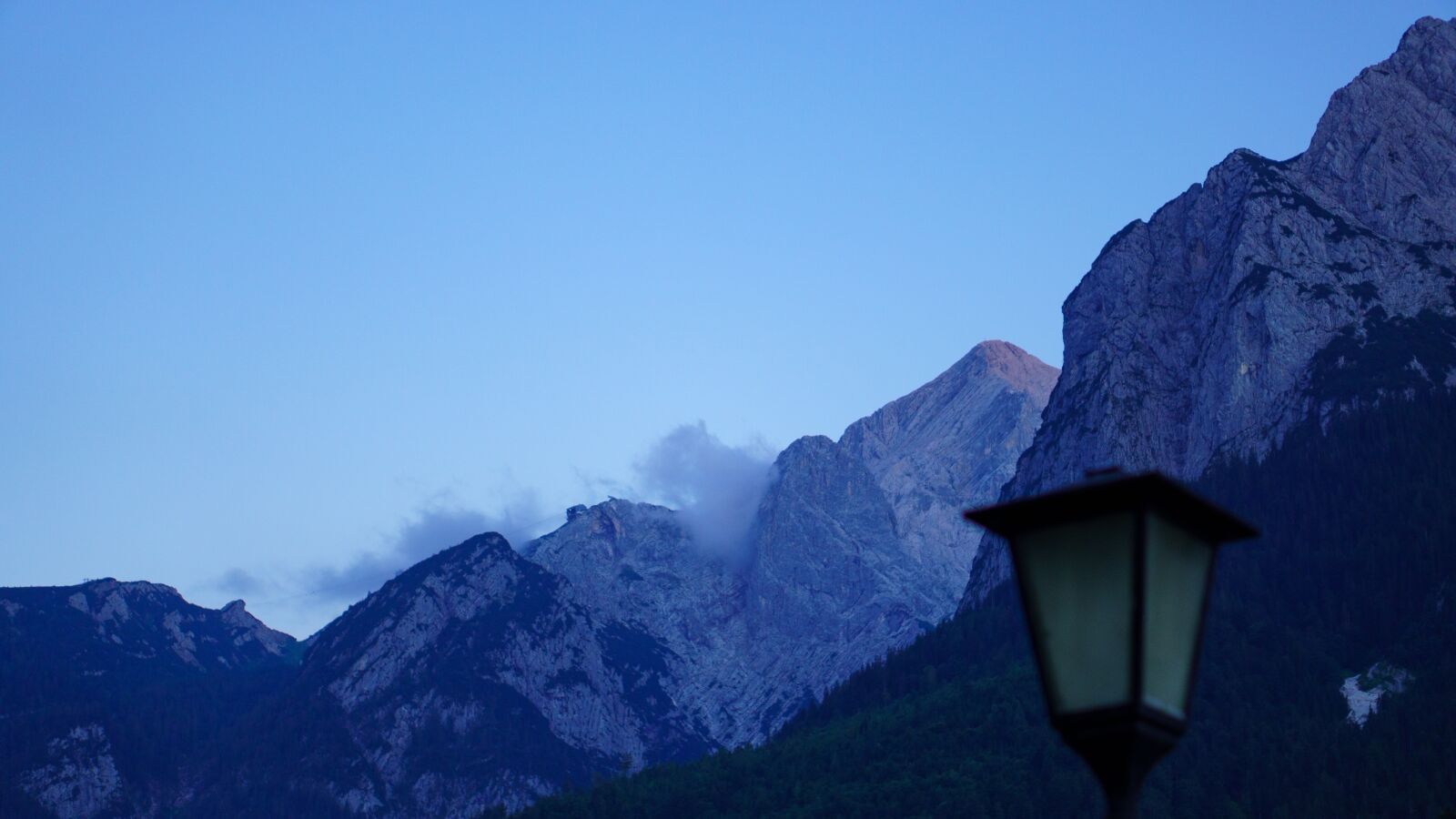 E 50mm F1.8 OSS sample photo. Mountains, summit, lantern photography