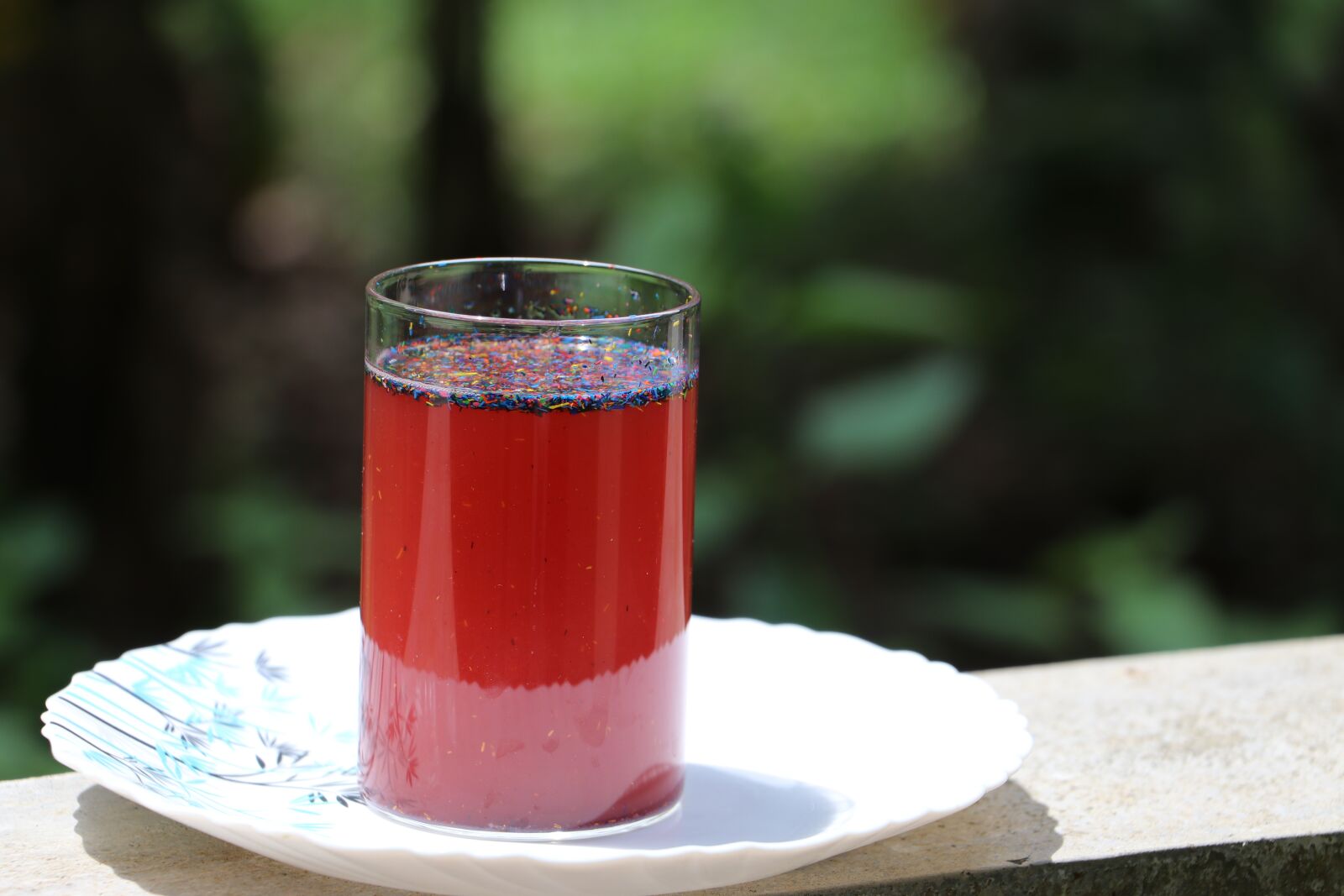 Canon EF-S 18-135mm F3.5-5.6 IS USM sample photo. Glass, color liquid, red photography