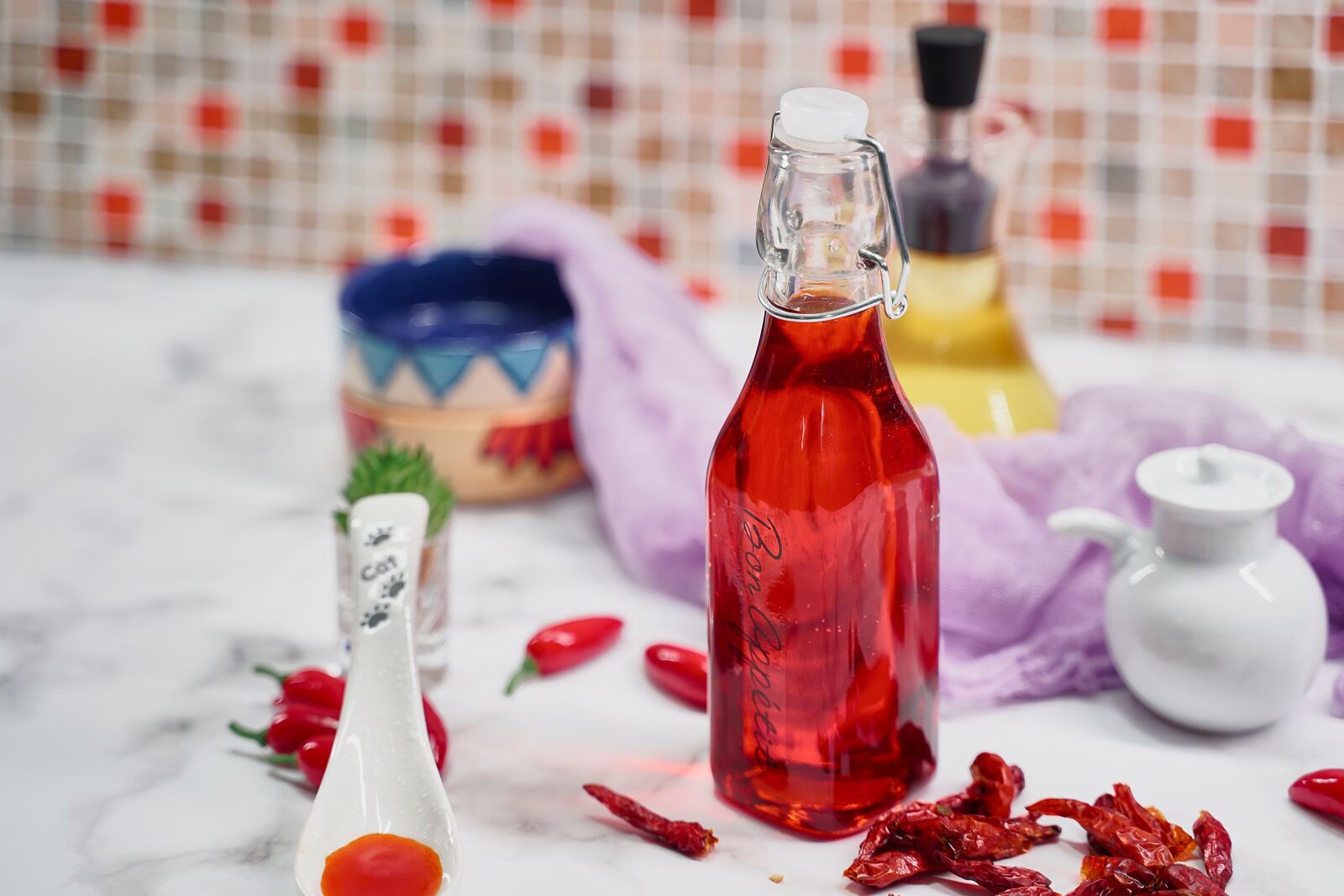Tamron 28-75mm F2.8 Di III RXD sample photo. Chili oil, oil, herb photography
