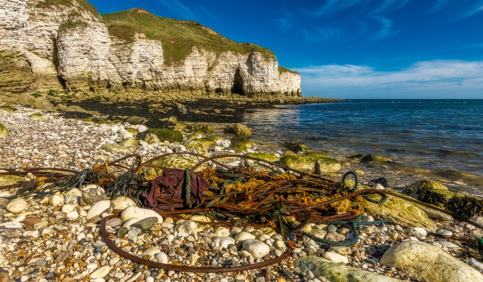Tokina AT-X Pro 11-16mm F2.8 DX II sample photo. Beach, litter, junk photography