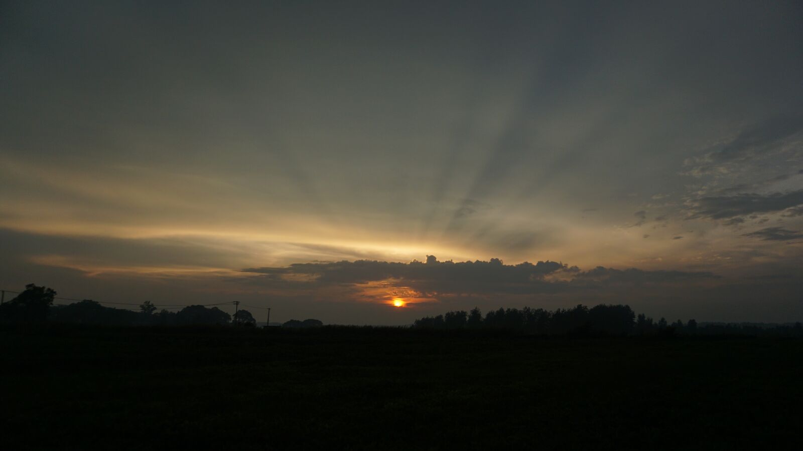 Sony a5100 sample photo. Sunset, ray, backlighting photography