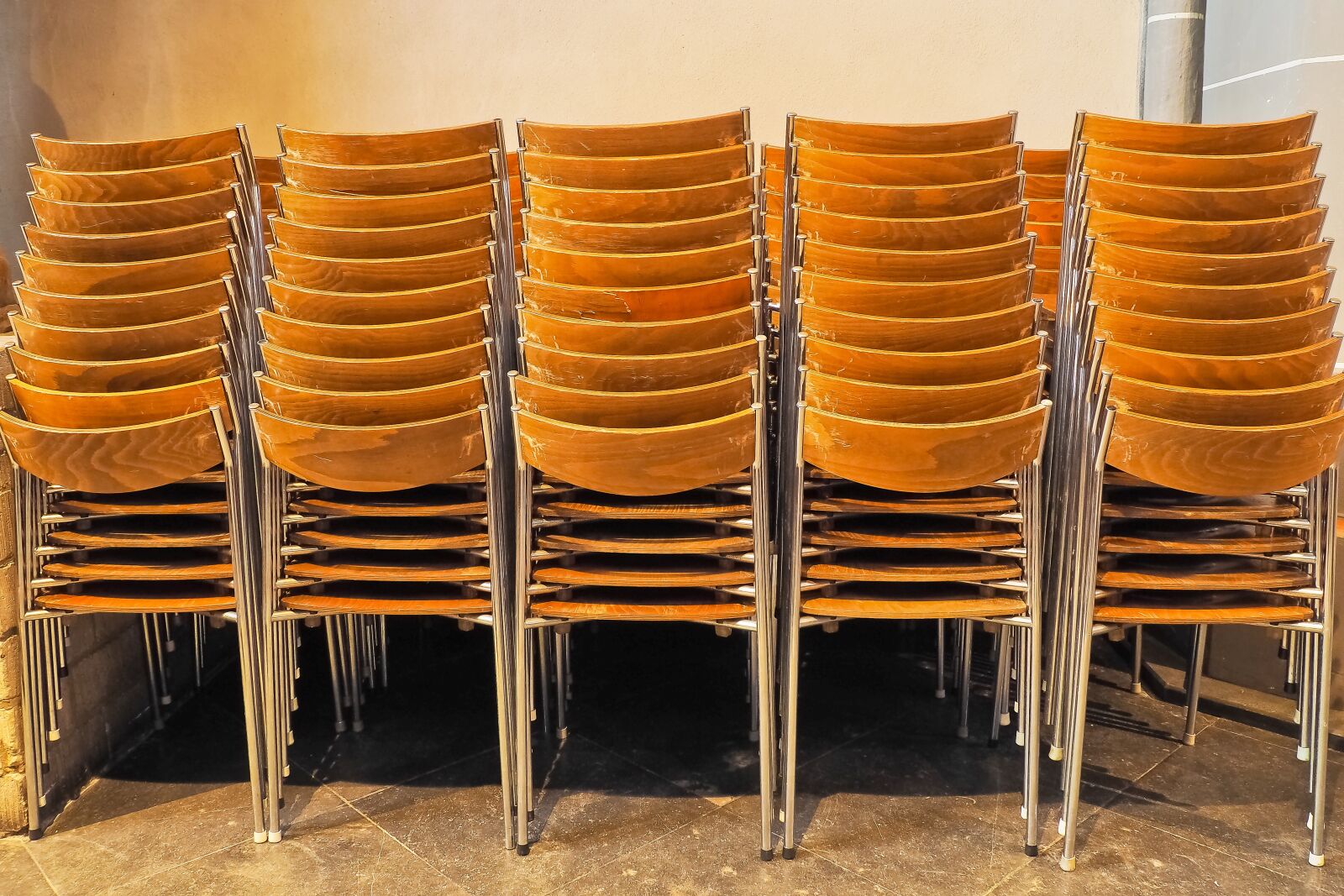 Olympus OM-D E-M10 sample photo. Chairs, stacked, stack photography