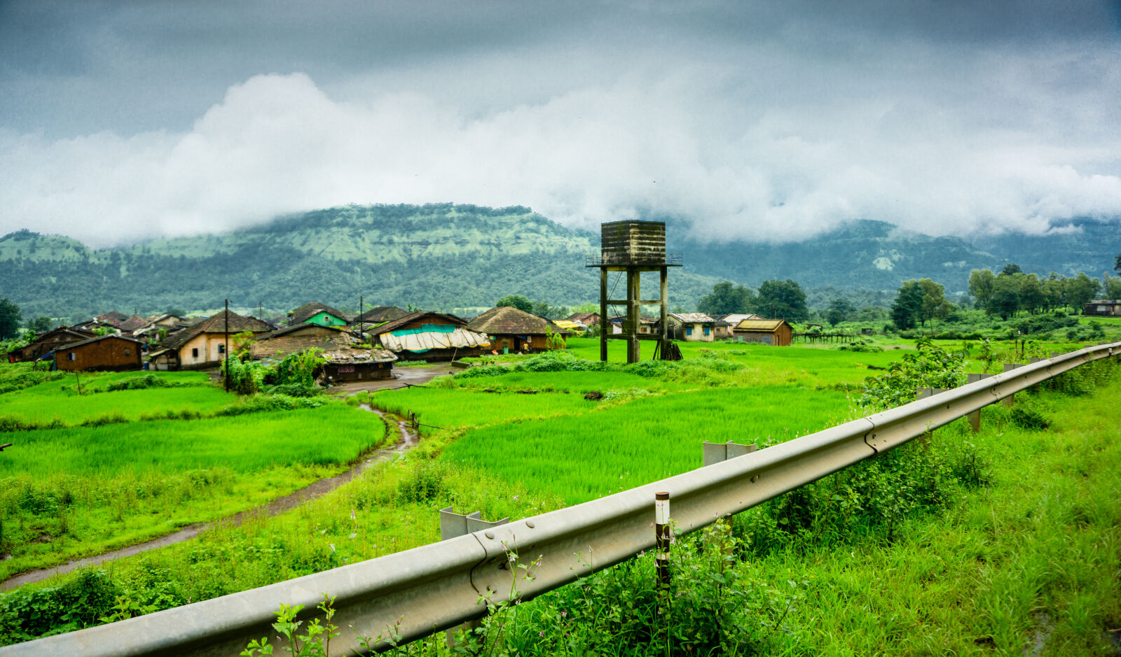 Sony a6000 sample photo. Clouds, countryside, grass, green photography