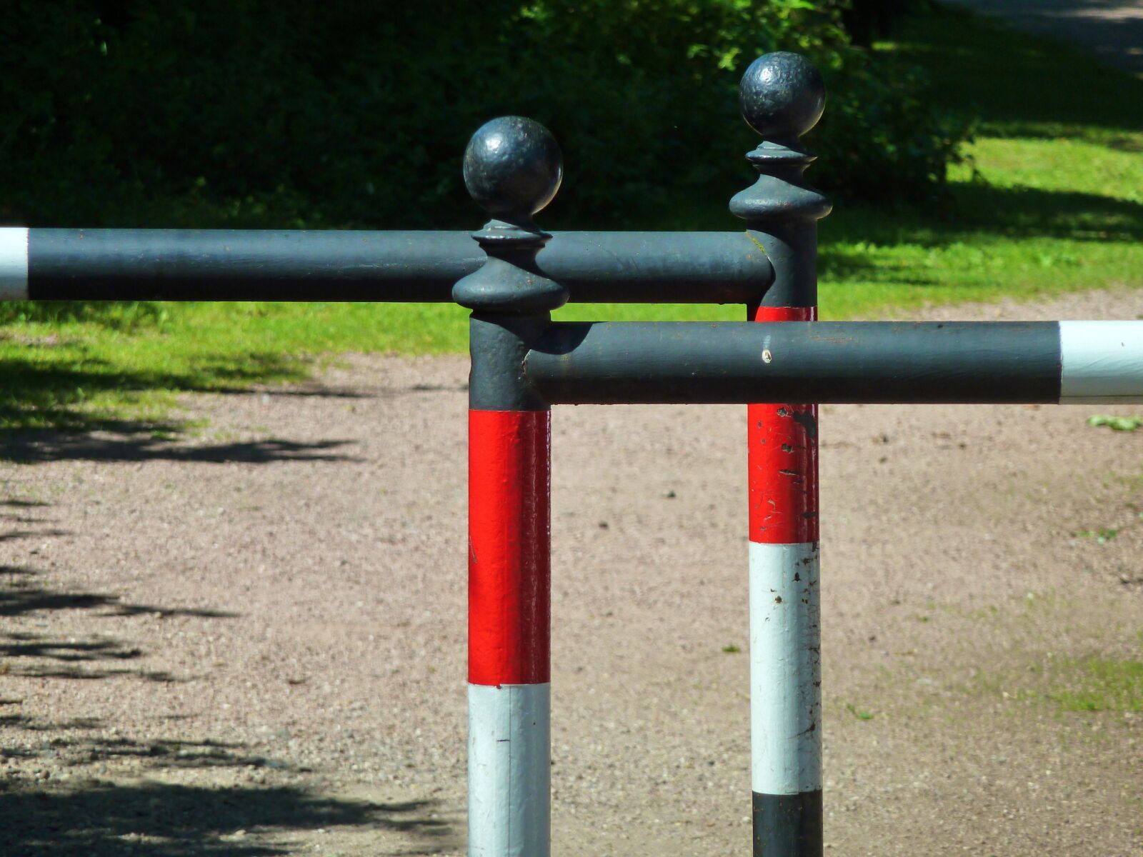 Panasonic DMC-TZ7 sample photo. Pedestrian railings, barrier, red photography