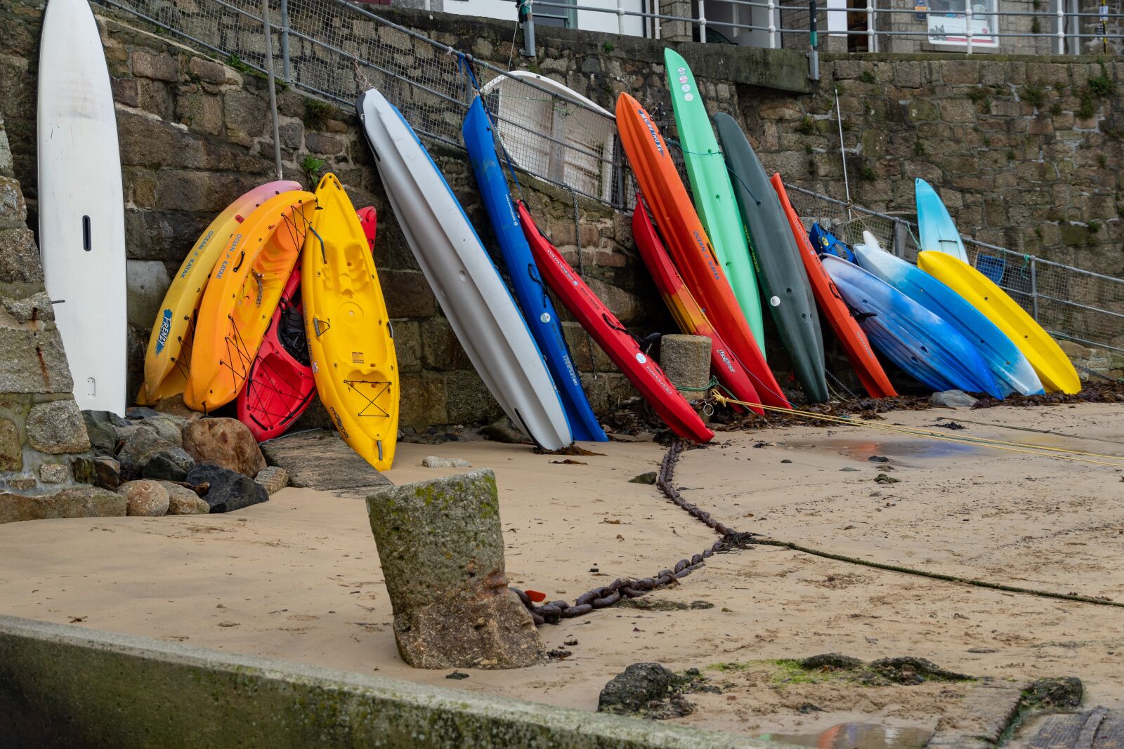 Sony E 18-135mm F3.5-5.6 OSS sample photo. Standing kayaks, harbor, low photography