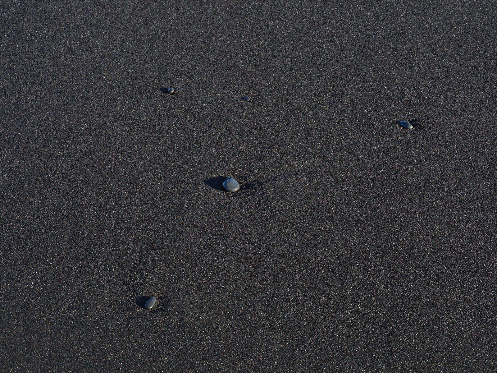 Olympus M.Zuiko Digital ED 12-100mm F4.0 IS Pro sample photo. Beach, stones, black beach photography
