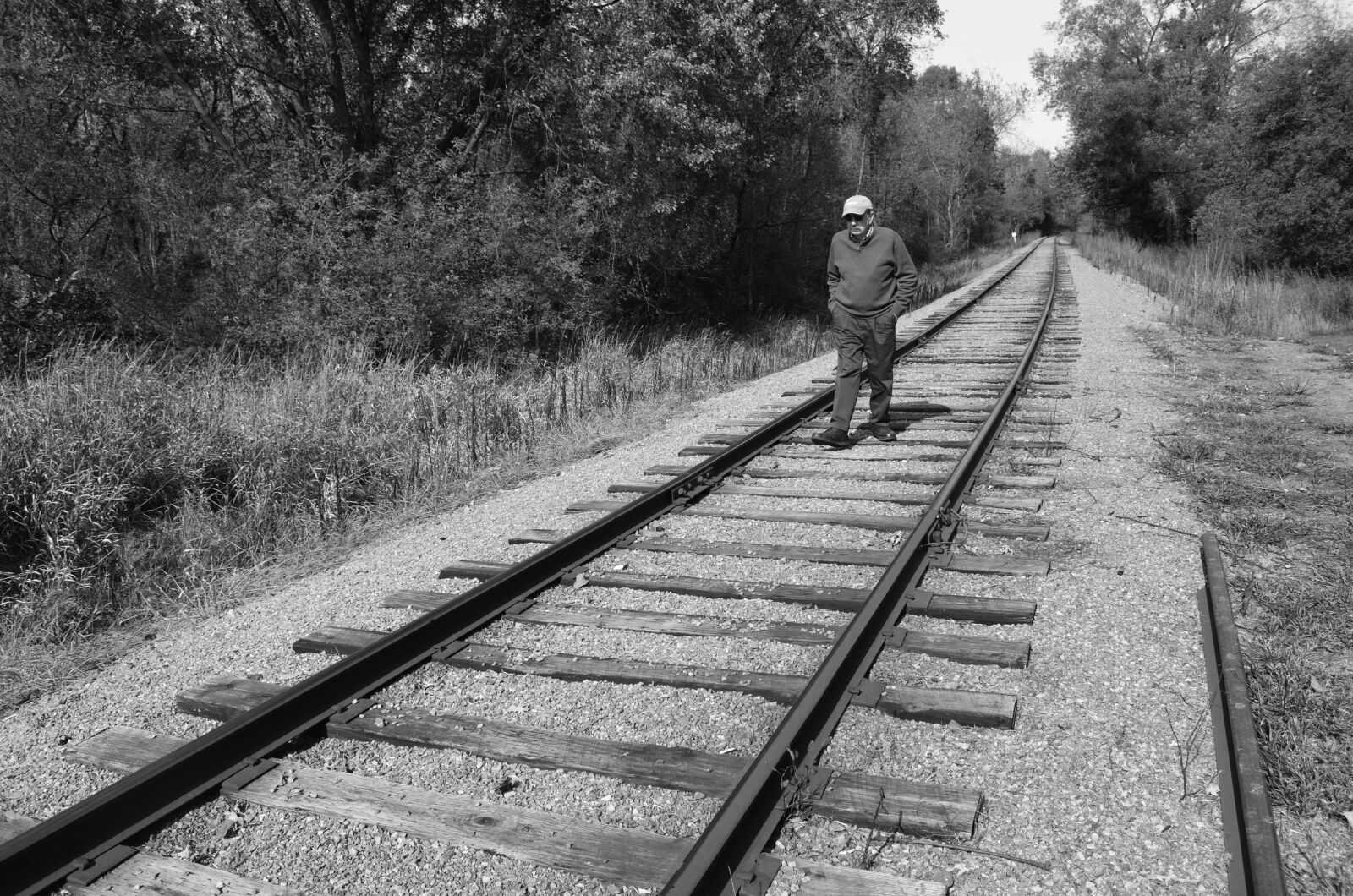 Nikon D5100 sample photo. Man, walking, railroad photography