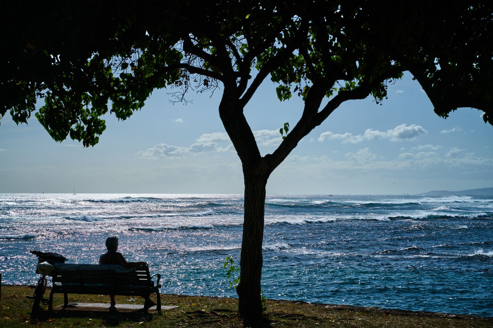 Tamron 28-75mm F2.8 Di III RXD sample photo. Seaside, bench, shade photography