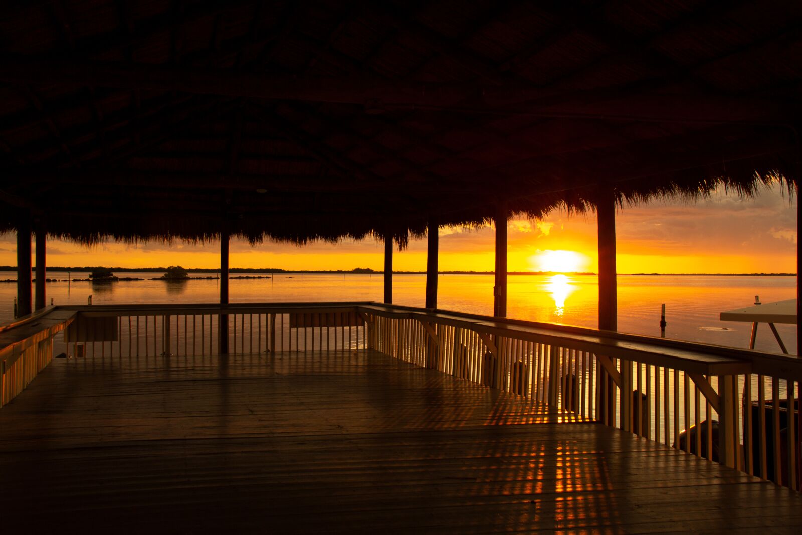 Canon EOS 60D sample photo. Sunset, water, cabana photography