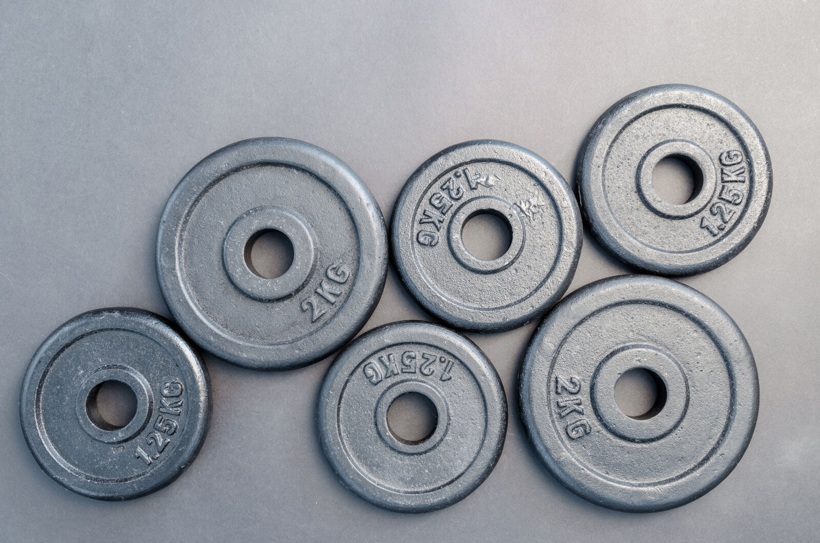 Nikon D5100 sample photo. Six, assorted, weight, plates photography