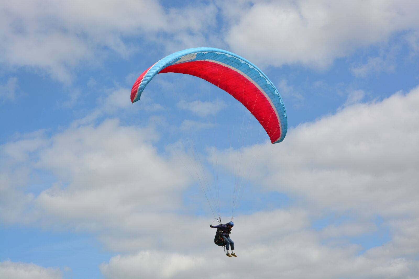 Nikon D5200 sample photo. Paragliding, red wing blue photography