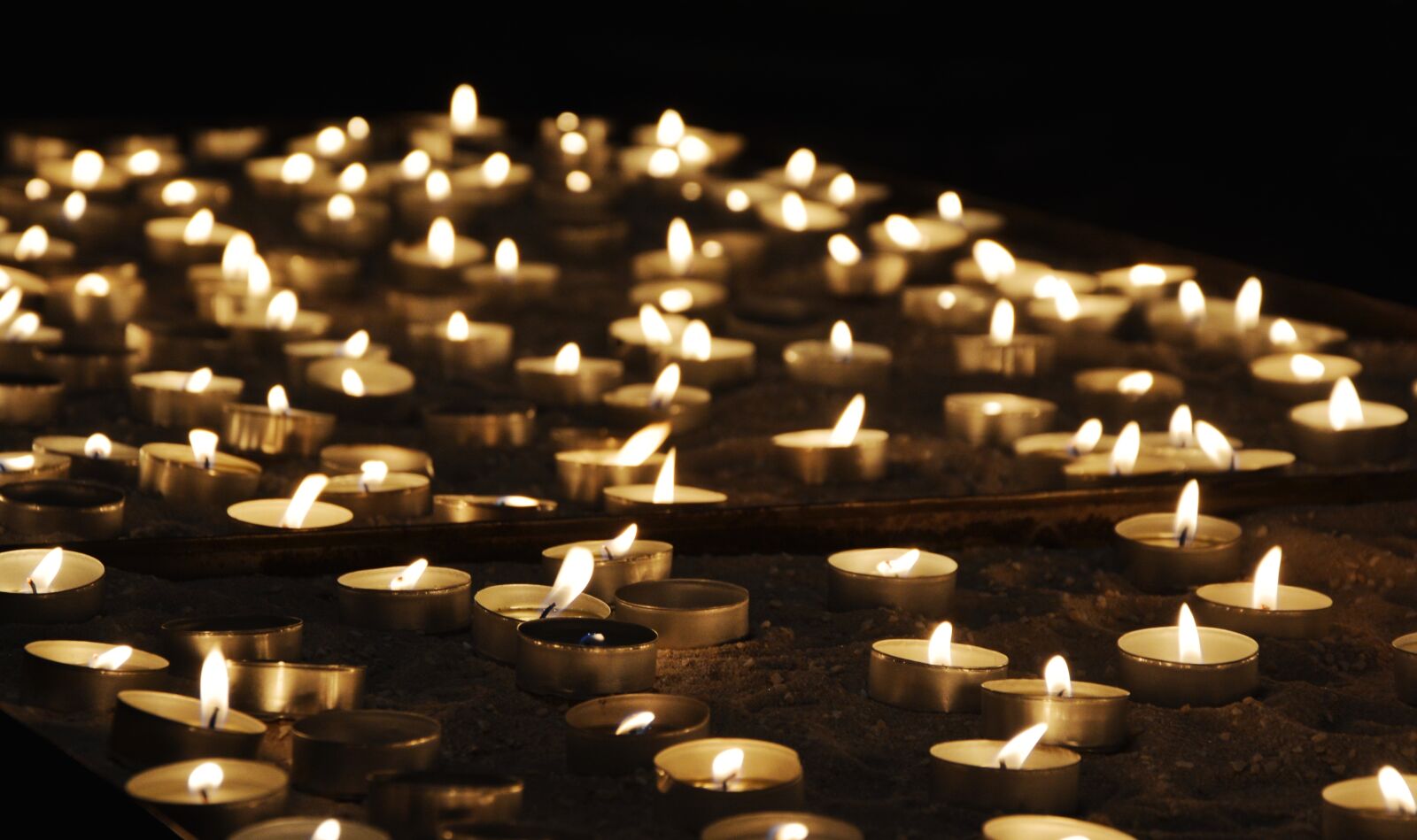 Nikon D5200 sample photo. Tea lights, church, light photography