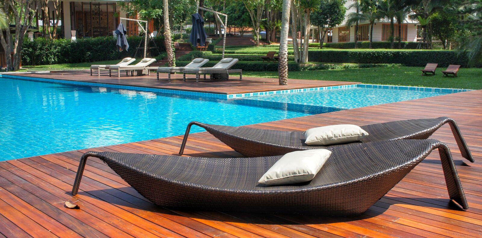 Sony Alpha NEX-3 + Sony E 18-55mm F3.5-5.6 OSS sample photo. Relaxing, loungers, pool side photography
