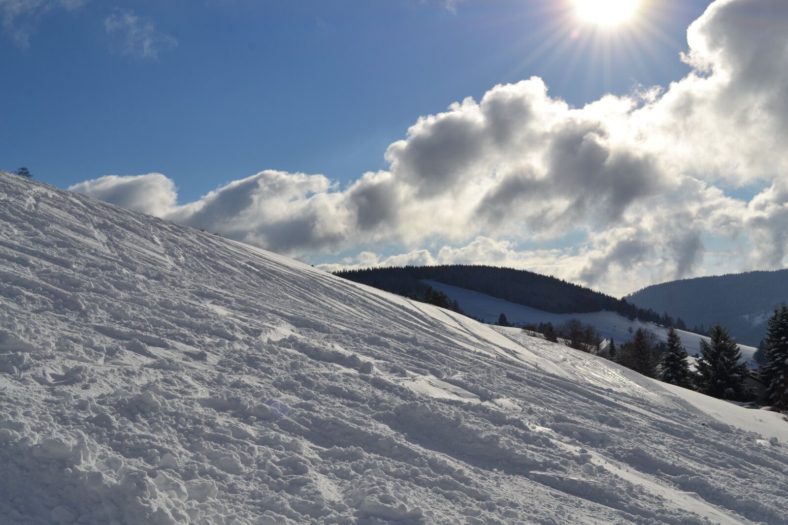 Nikon D3100 sample photo. Snow, sun, runway photography