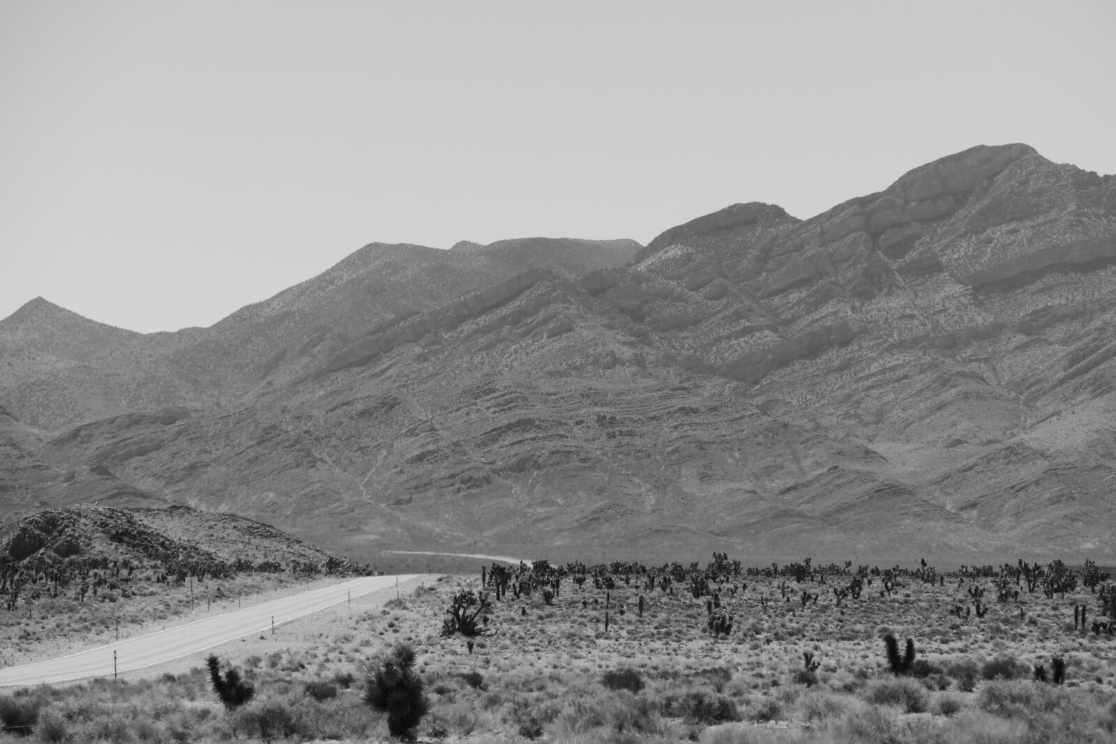Panasonic Lumix DMC-FZ1000 sample photo. Desert, road, black photography