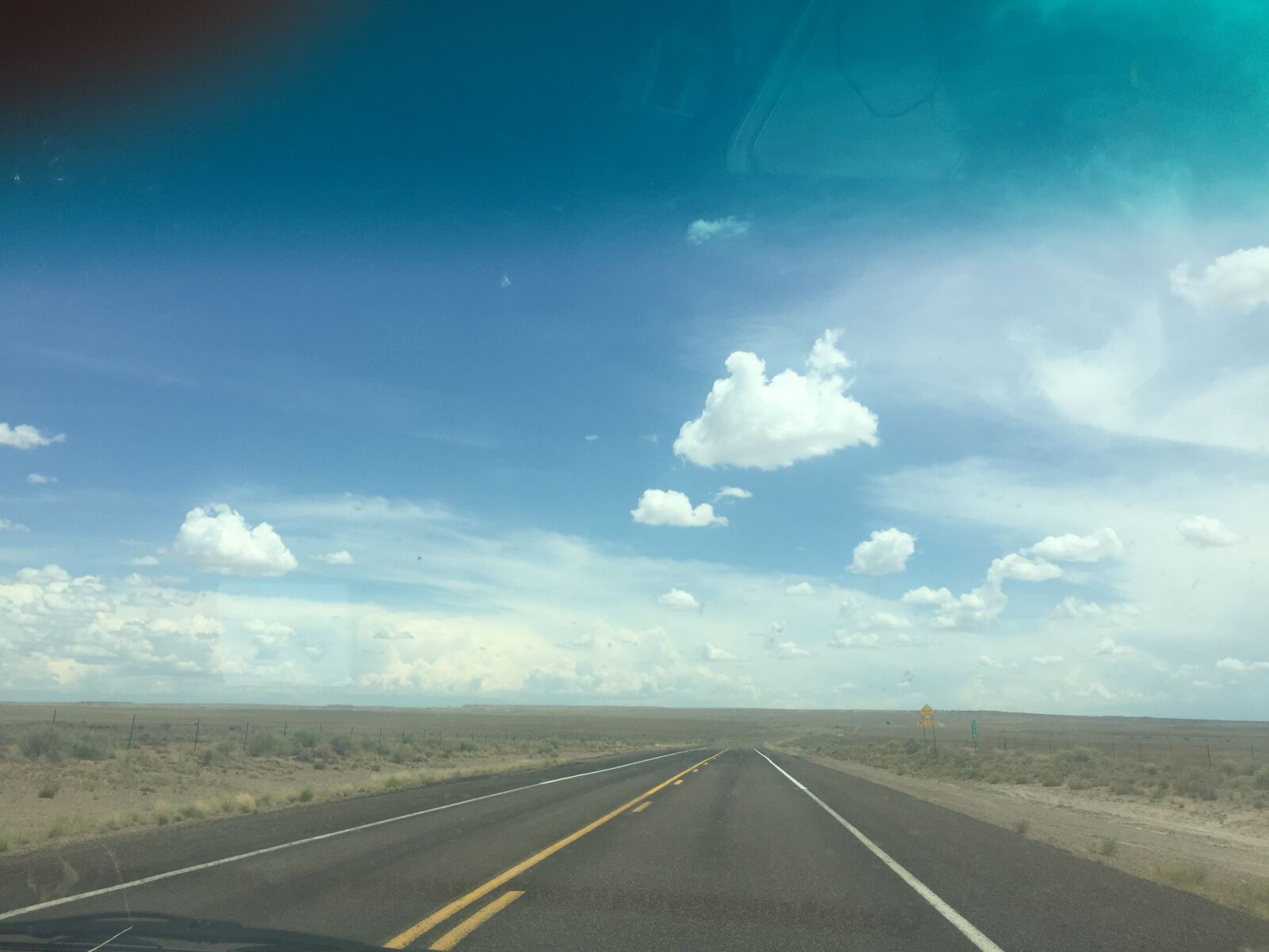 iPhone 6 back camera 4.15mm f/2.2 sample photo. Empty road, big sky photography
