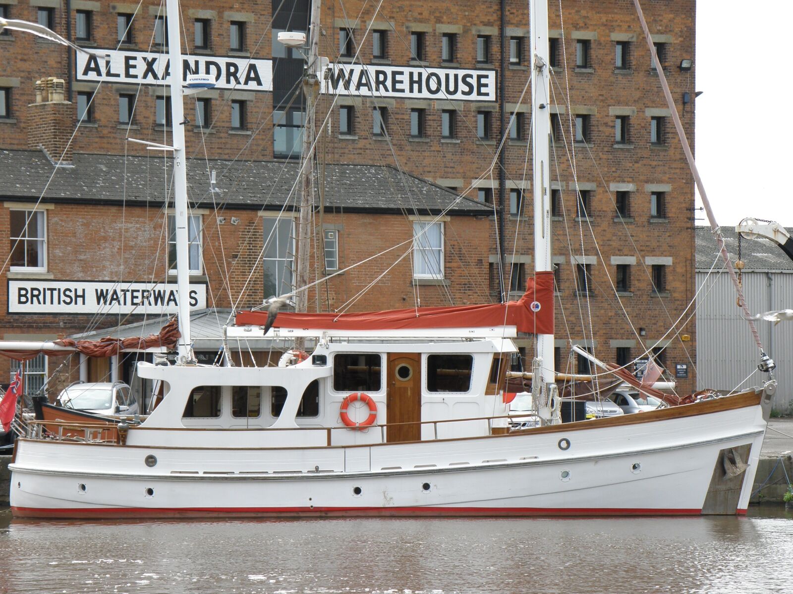 Olympus SP570UZ sample photo. Boat, quay, warehouse photography