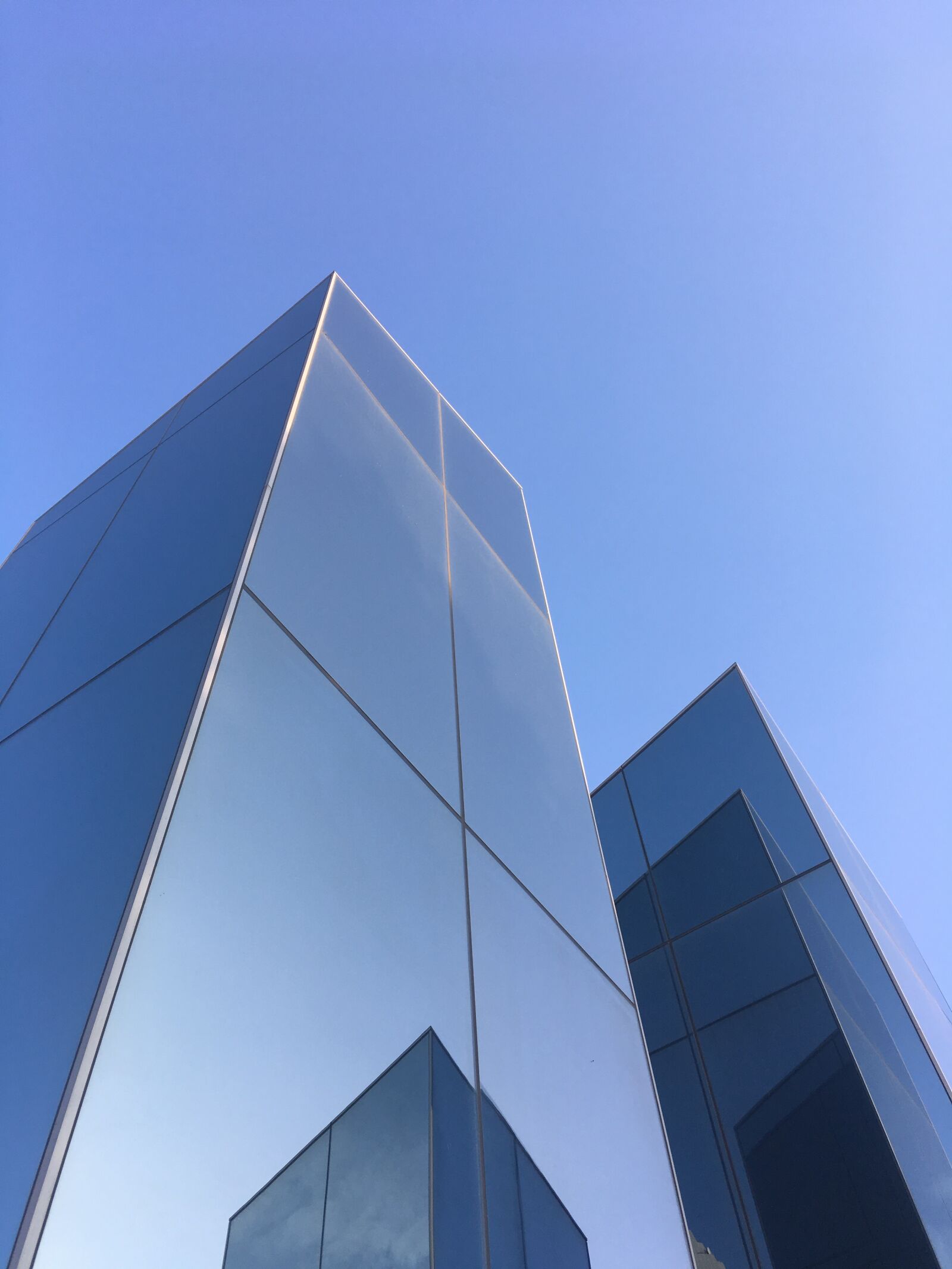 Apple iPhone SE sample photo. Blue sky, glass reflections photography