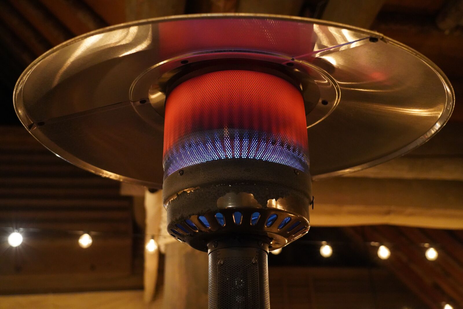 Sony FE 24-105mm F4 G OSS sample photo. Propane heater, fire, outdoor photography