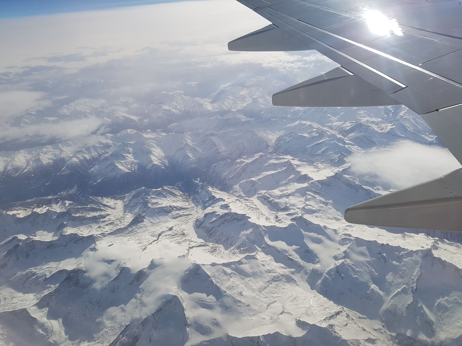 Samsung Galaxy S7 sample photo. On, airplane, above, mountains photography