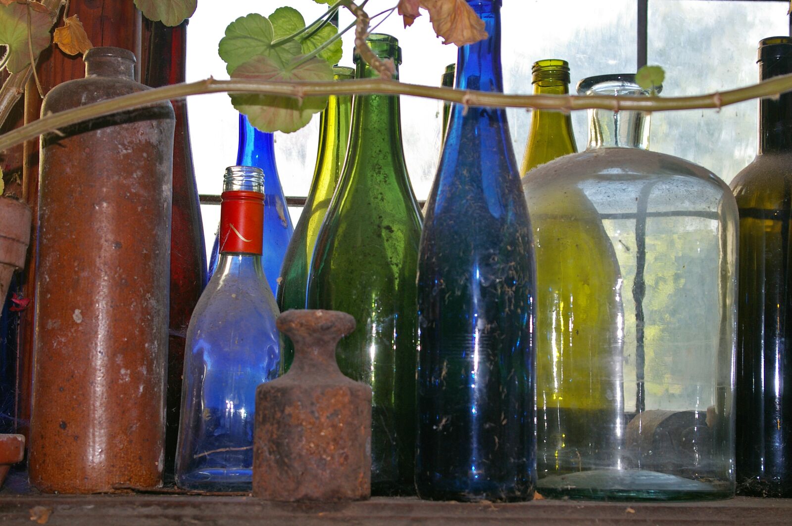 Pentax *ist DL2 sample photo. Old bottles, dusty, colorful photography