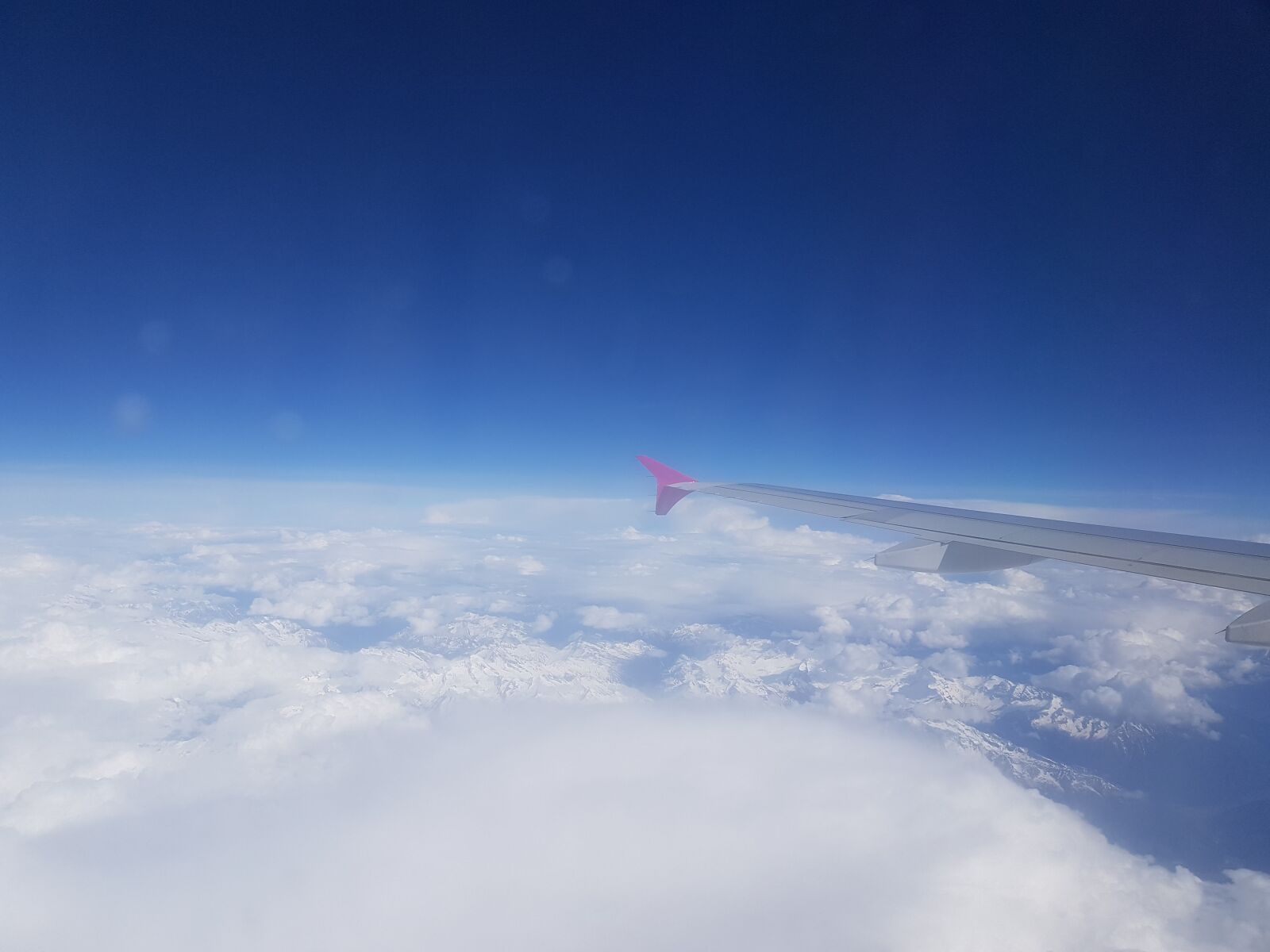 Samsung Galaxy S7 sample photo. Aircraft, turn signal, clouds photography