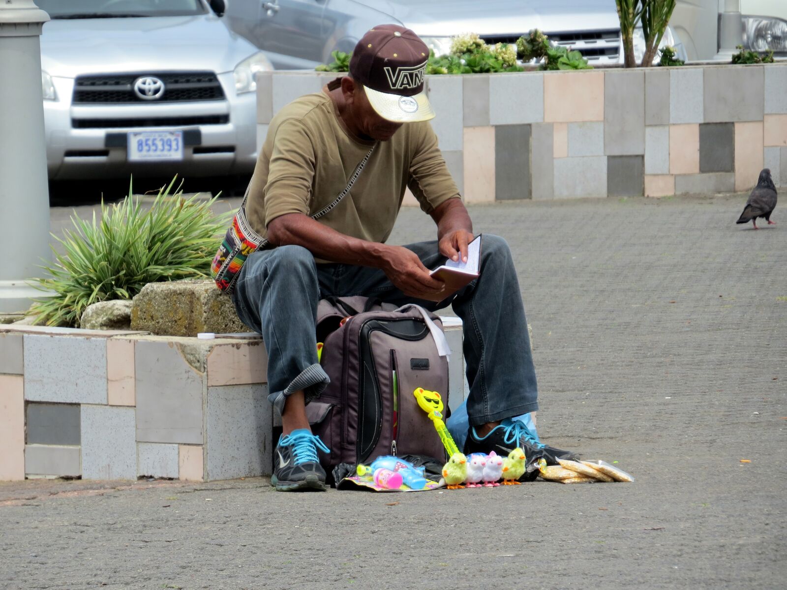 Canon PowerShot SX50 HS sample photo. Man, poverty, city photography