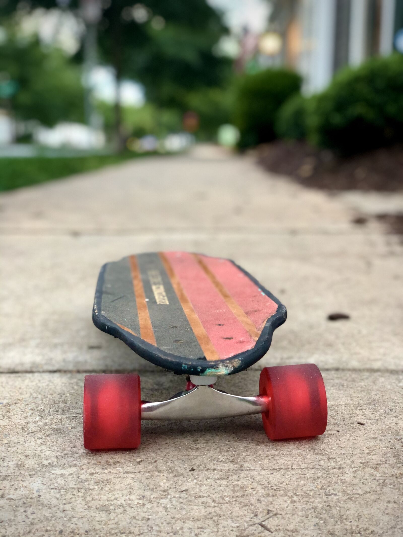 iPhone X back dual camera 6mm f/2.4 sample photo. Skateboard, sidewalk, pavement photography