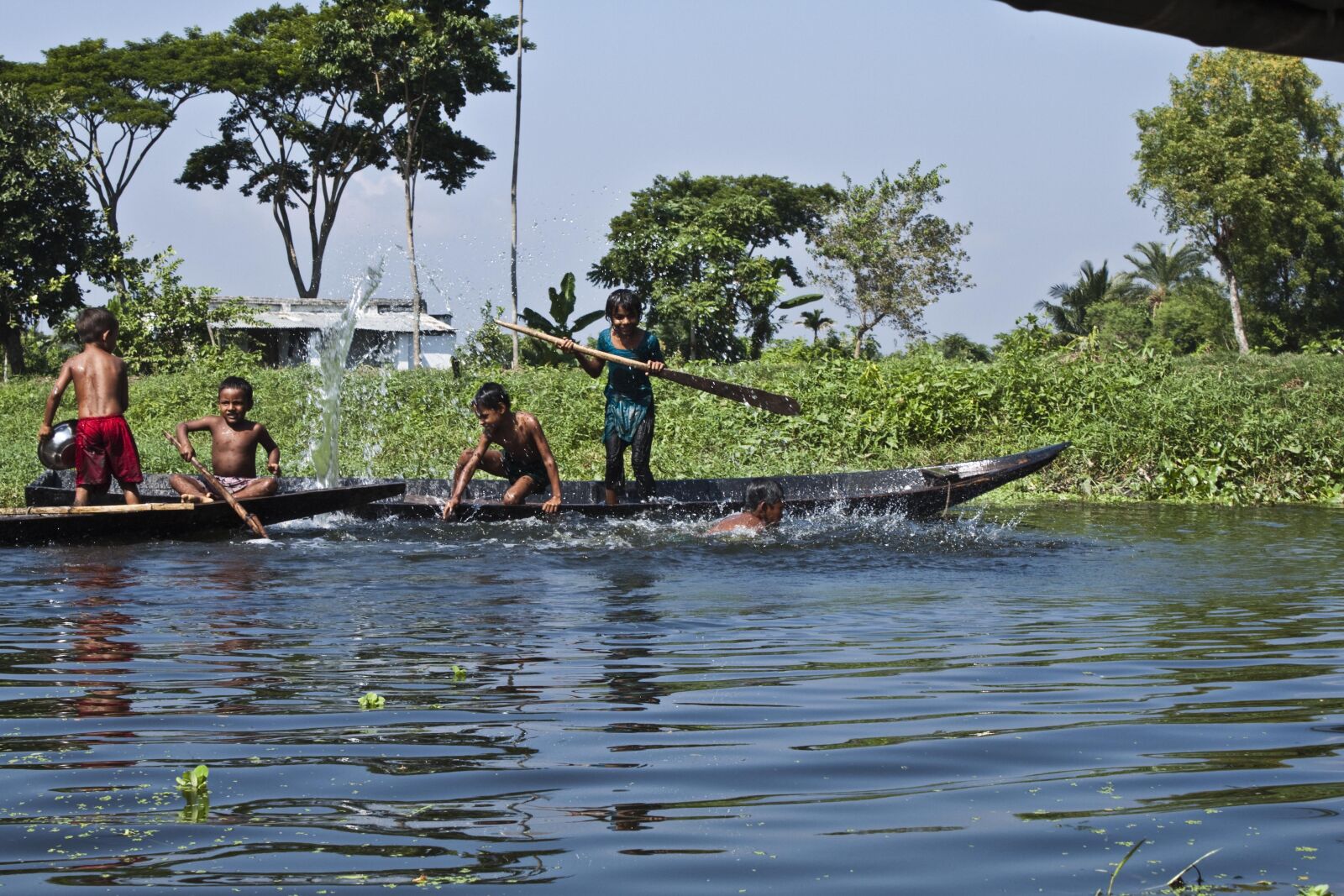 Canon EOS 500D (EOS Rebel T1i / EOS Kiss X3) sample photo. Bangladesh, boat, canal, fisherman photography