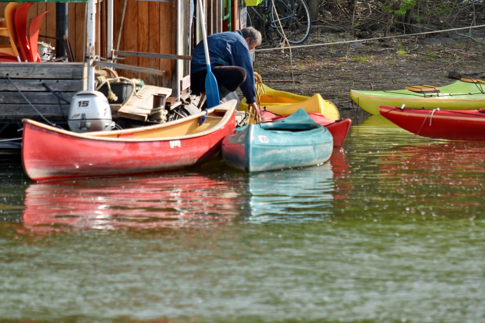 Nikon D5500 sample photo. Canoe, man, riverbank, water photography