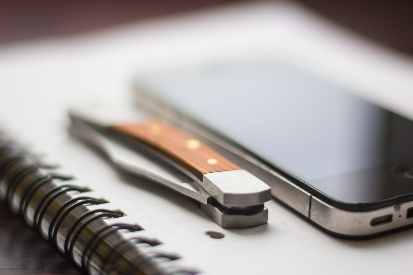 Canon EOS 60D + Canon EF 50mm F1.8 STM sample photo. Knife, notepad, phone photography