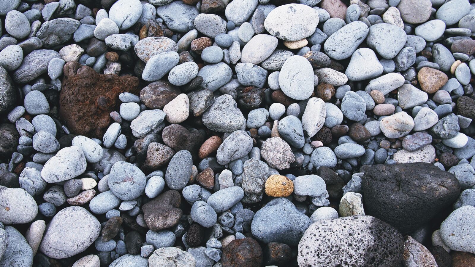 Olympus PEN E-PL1 sample photo. Rocks, pebbles, beach photography