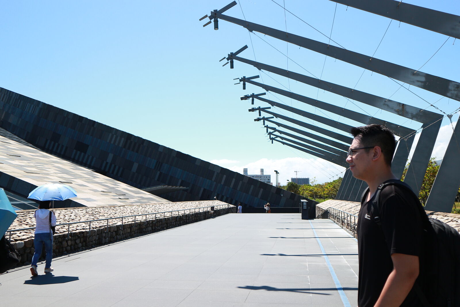 Canon EOS M sample photo. Young, man, using, mobile photography