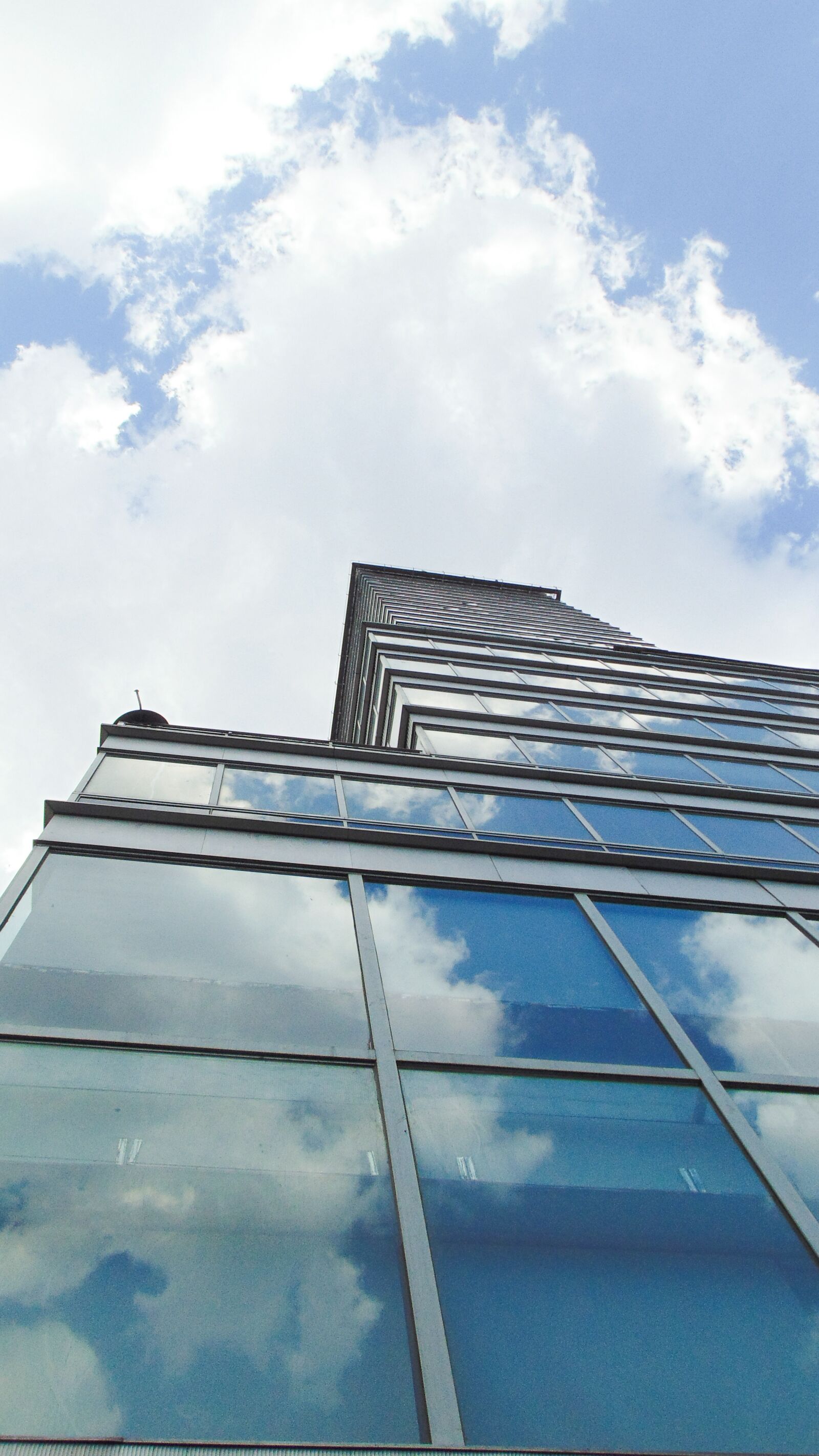 Sony Cyber-shot DSC-H300 sample photo. Building, cloud, tower photography