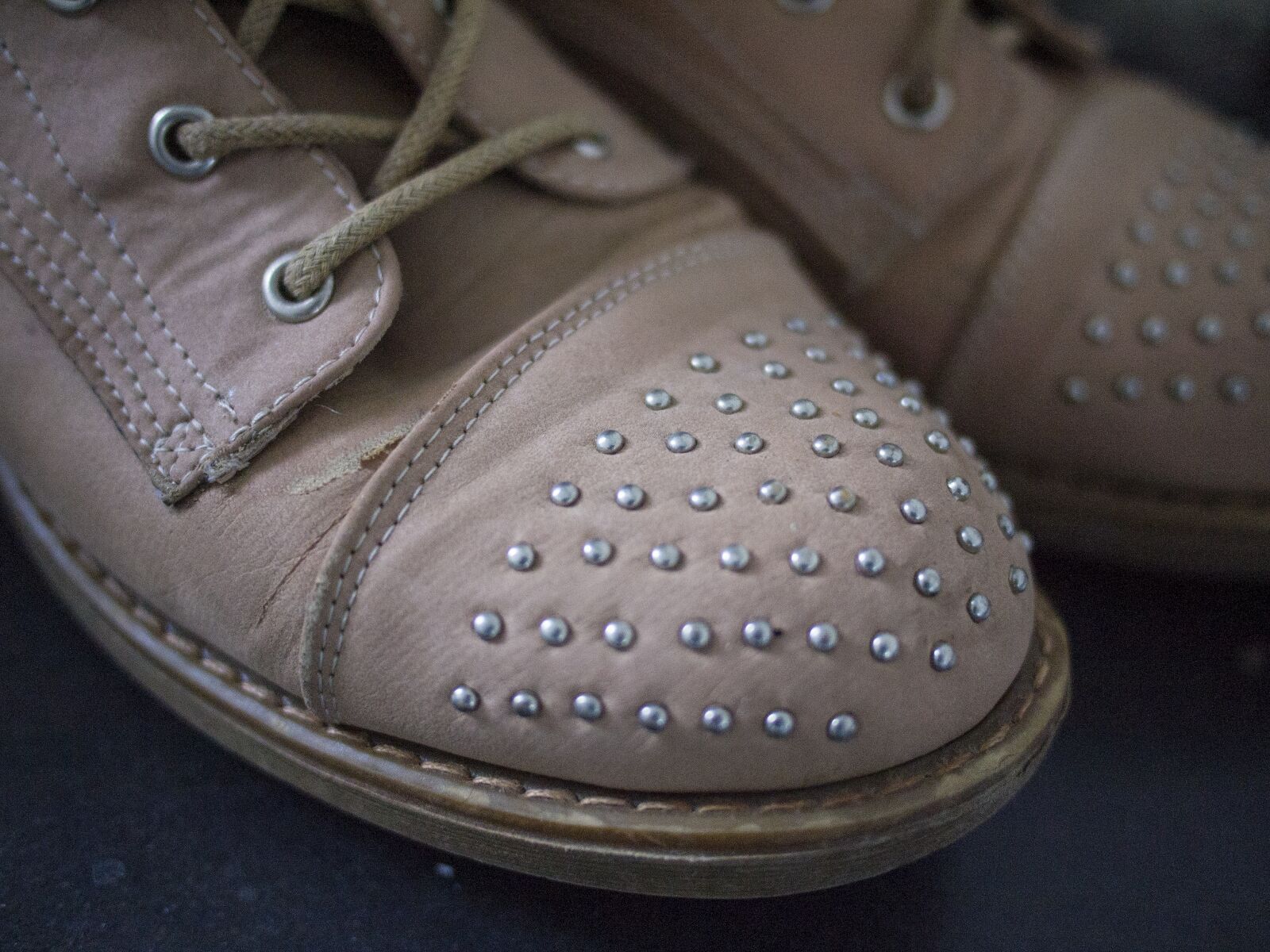 Olympus PEN E-PL1 + Panasonic Lumix G 20mm F1.7 ASPH sample photo. Shoes, studs, fashion photography