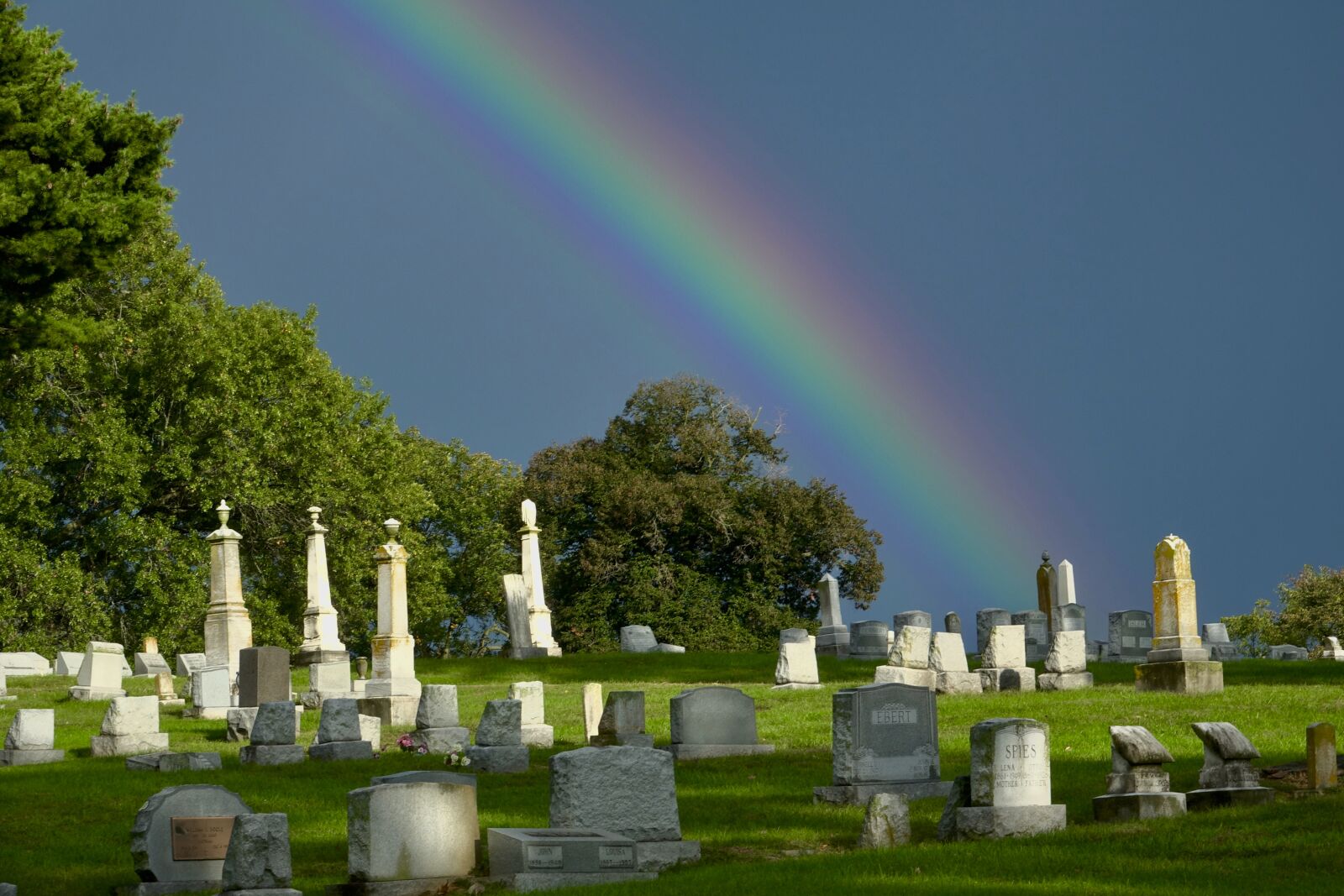 Sony Cyber-shot DSC-RX10 III sample photo. Rainbow, cemetery, sky photography