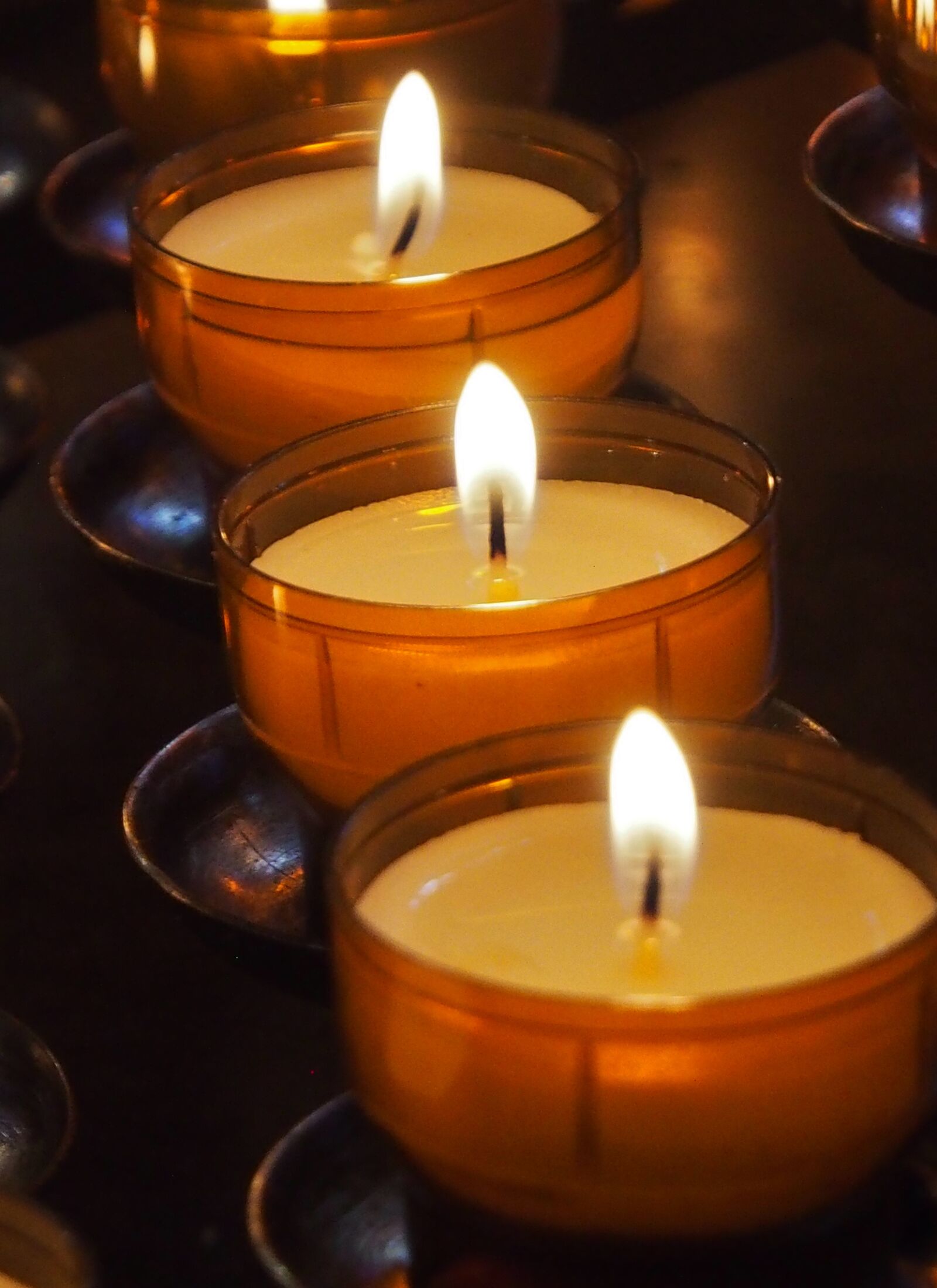 Olympus OM-D E-M5 sample photo. Candle, votive light, religion photography