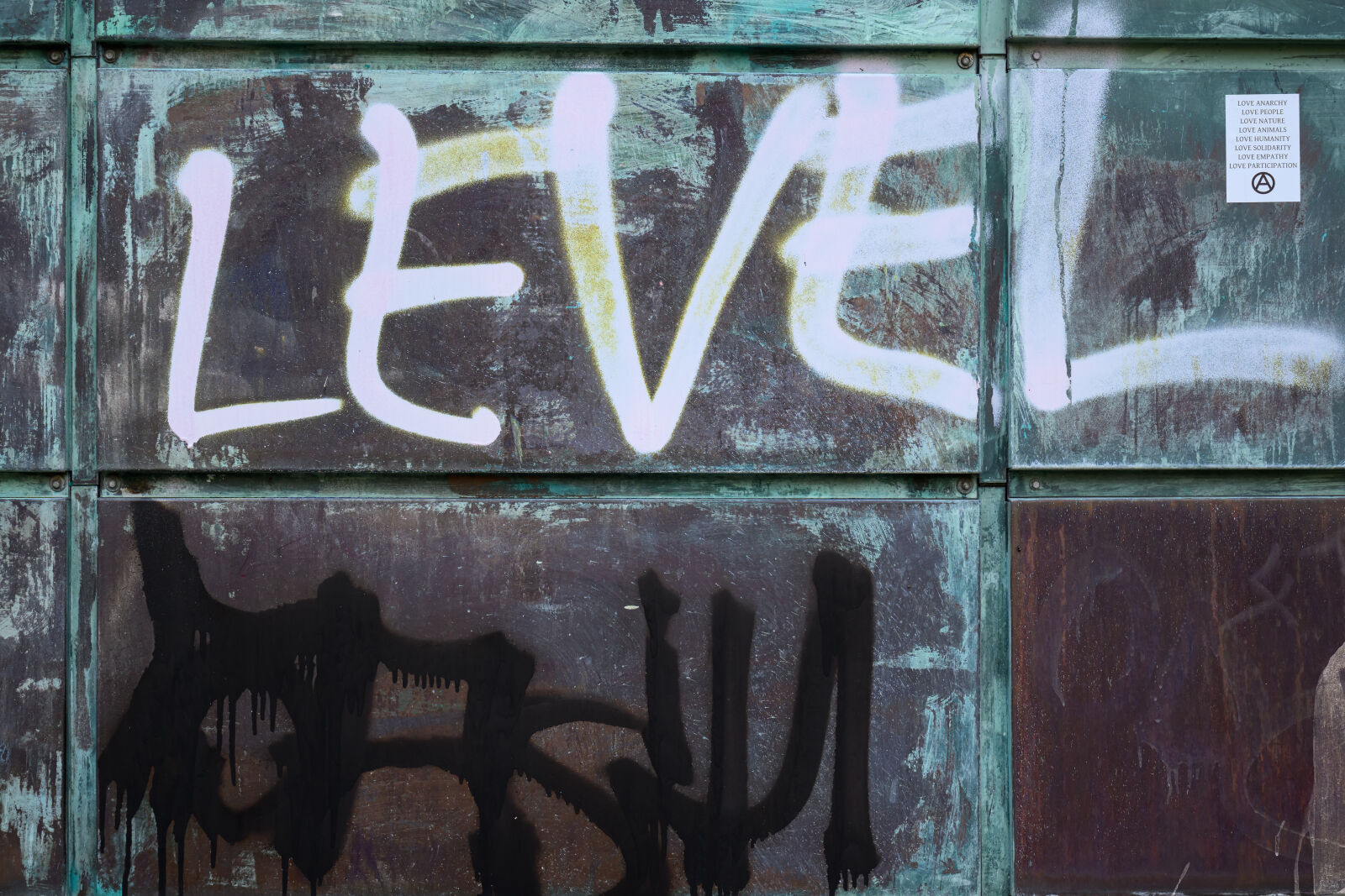 Tamron 90mm F2.8 Di III Macro VXD sample photo. Level wall anarchy photography