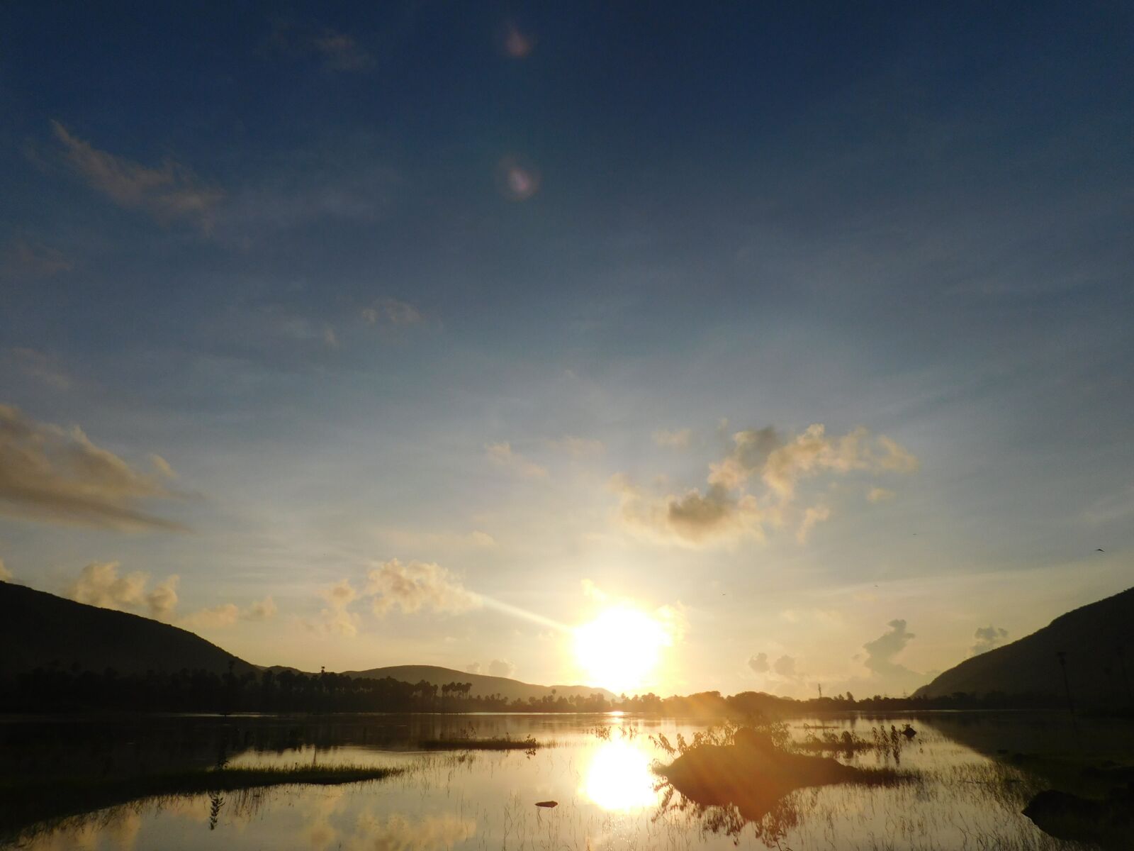 Nikon Coolpix L840 sample photo. Sunrise, hills, water photography