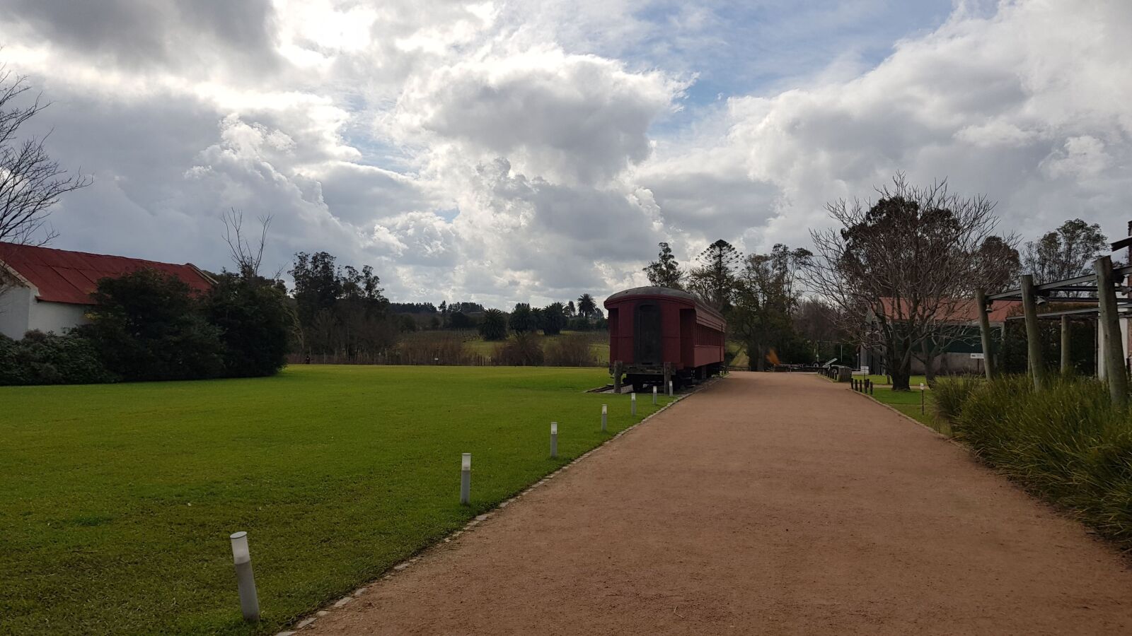 Samsung Galaxy S8 sample photo. Clouds, train, grass photography