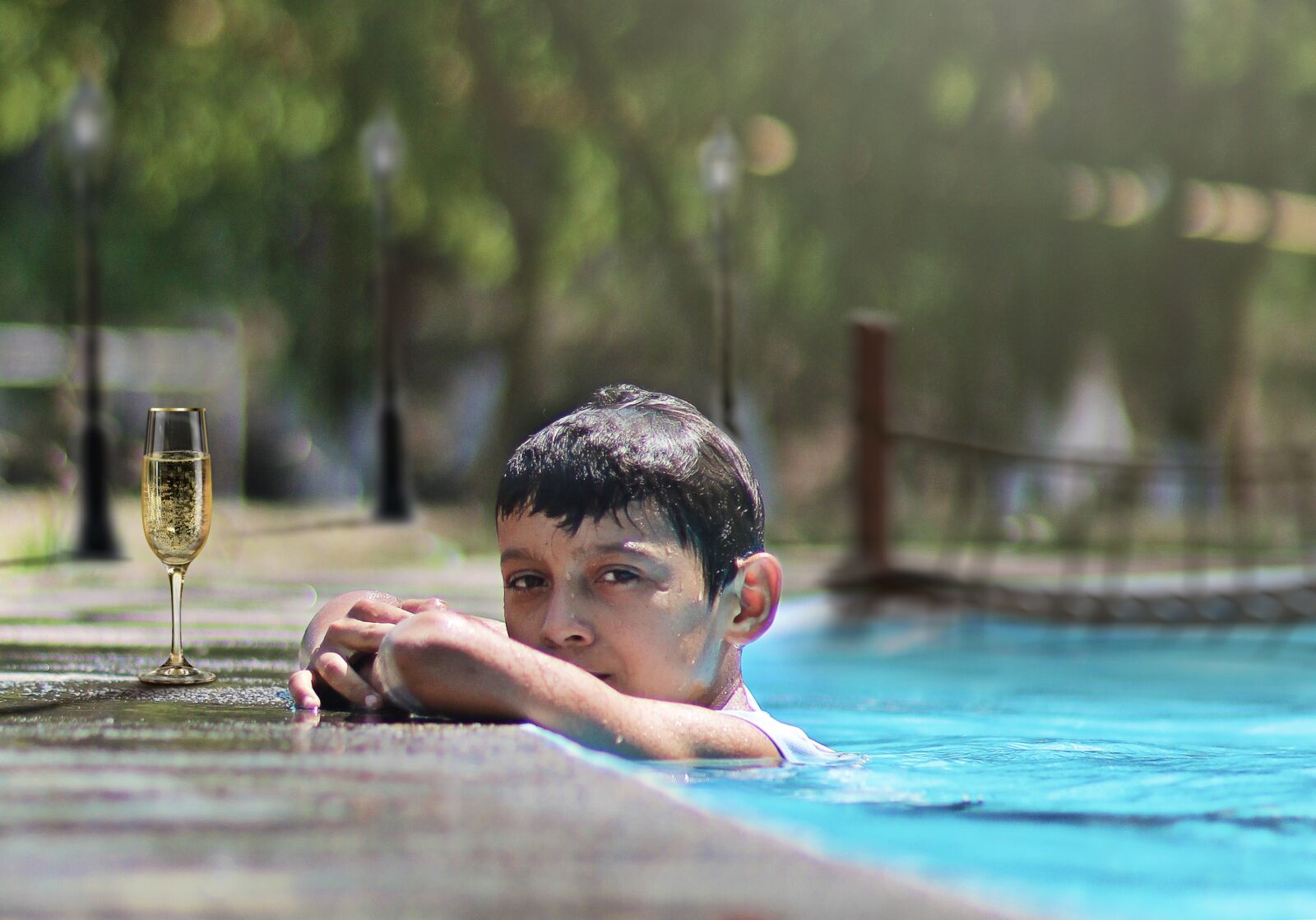 Canon YN85mm f/1.8 DCM sample photo. Pool, cup, sun photography