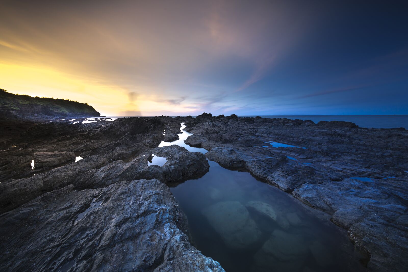 Sony a7R II + Voigtlander ULTRA WIDE-HELIAR 12mm F5.6 III sample photo. Volcanic rock, coral, adventure photography