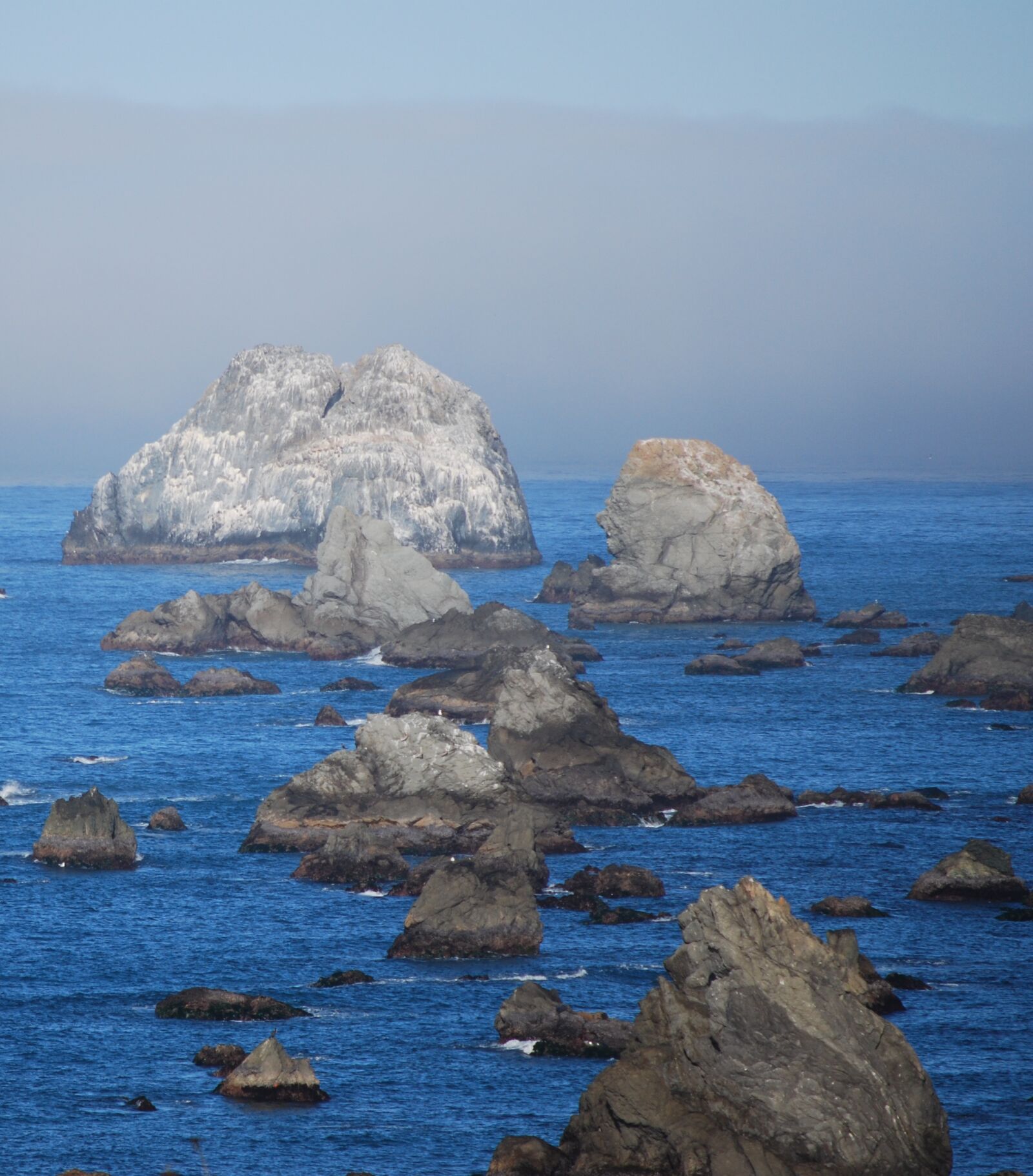 Nikon D60 sample photo. Ocean, rocks, blue photography
