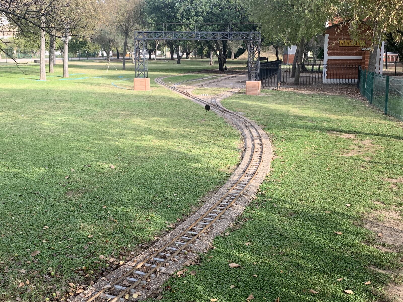 iPhone XS Max back dual camera 4.25mm f/1.8 sample photo. Train, park, blue photography