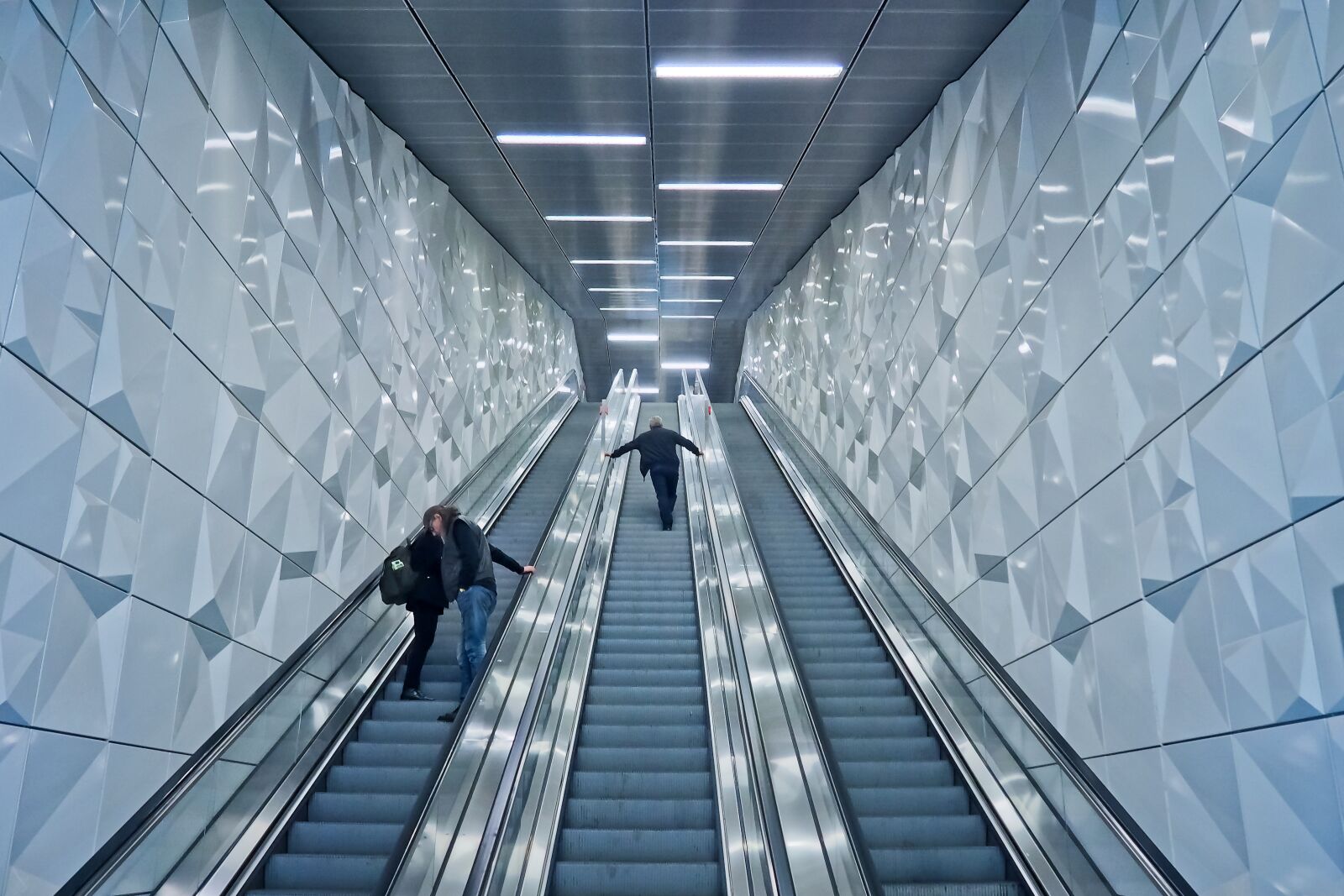 Olympus OM-D E-M10 sample photo. Escalator, underground, handrails photography